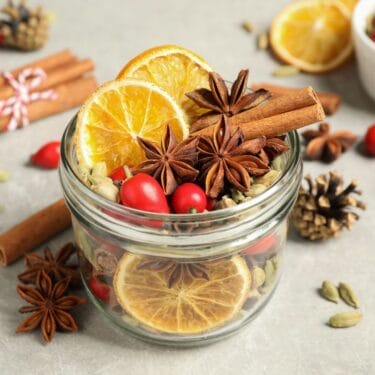 A 1/4 pint mason jar with dried citrus potpourri.