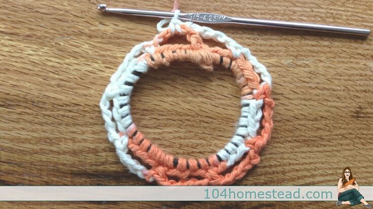 Mason jar feeders and waterers are great, but they can be hard to hang. Here is an easy crochet holder that will keep your feeder and waterer off the ground.