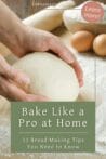 Hands kneading soft bread dough on a floured wooden surface with eggs and flour in the background.