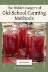 Three upside-down jars of homemade preserves with bright red liquid and petals. Text overlay reads: The Hidden Dangers of Old-School Canning Methods.