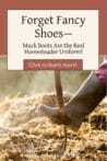 A person wearing muck boots steps onto a pitchfork in a pile of straw, perfectly capturing the hardworking homesteader lifestyle.