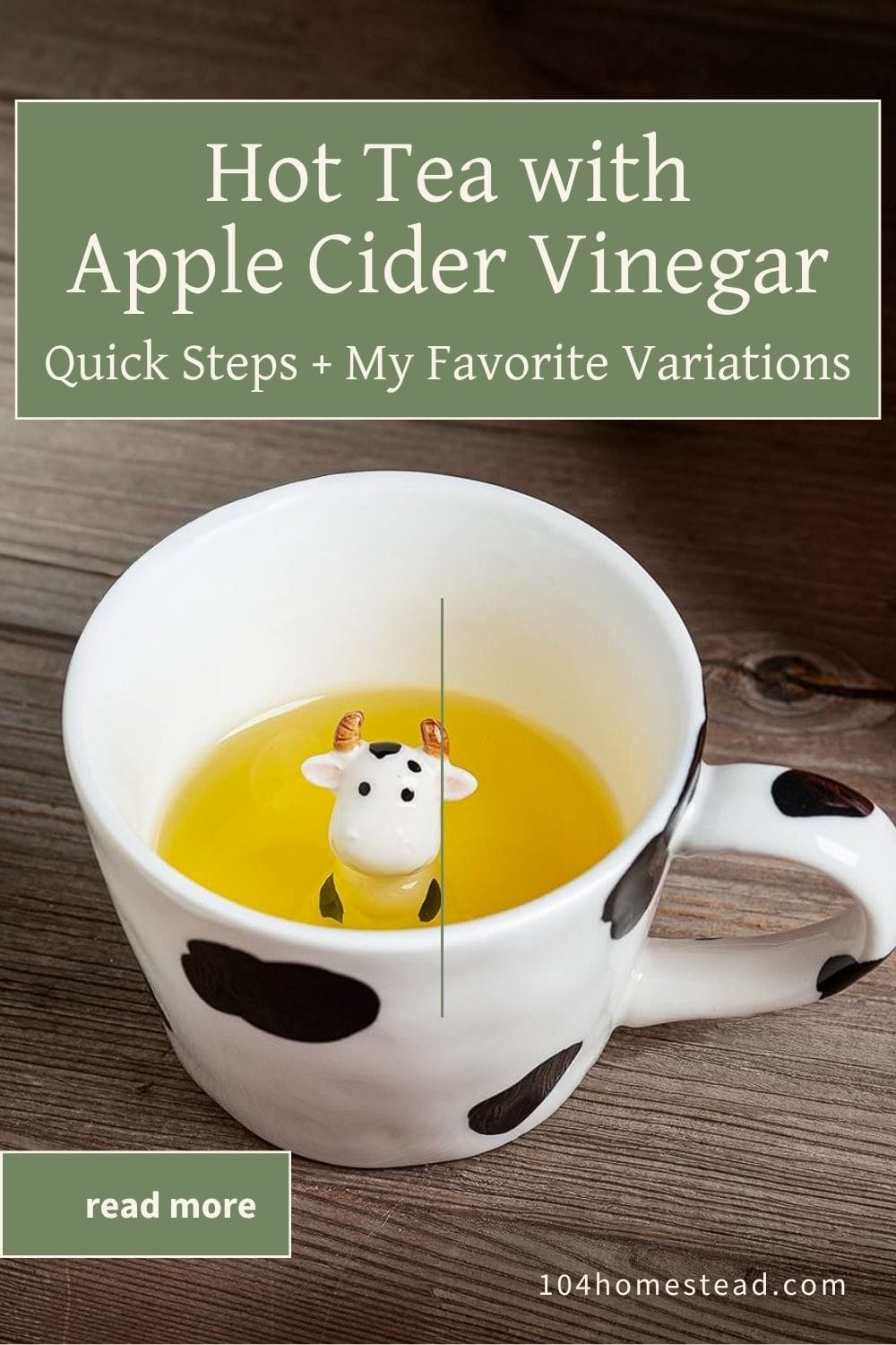 A white cow-print mug filled with bright yellow hot tea, with a tiny ceramic cow figurine rising up from the bottom of the cup. The mug sits on a rustic wooden table.