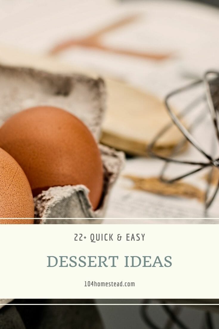 Carton of brown eggs sitting on the counter with a wooden spoon, tea towel, and whisk.