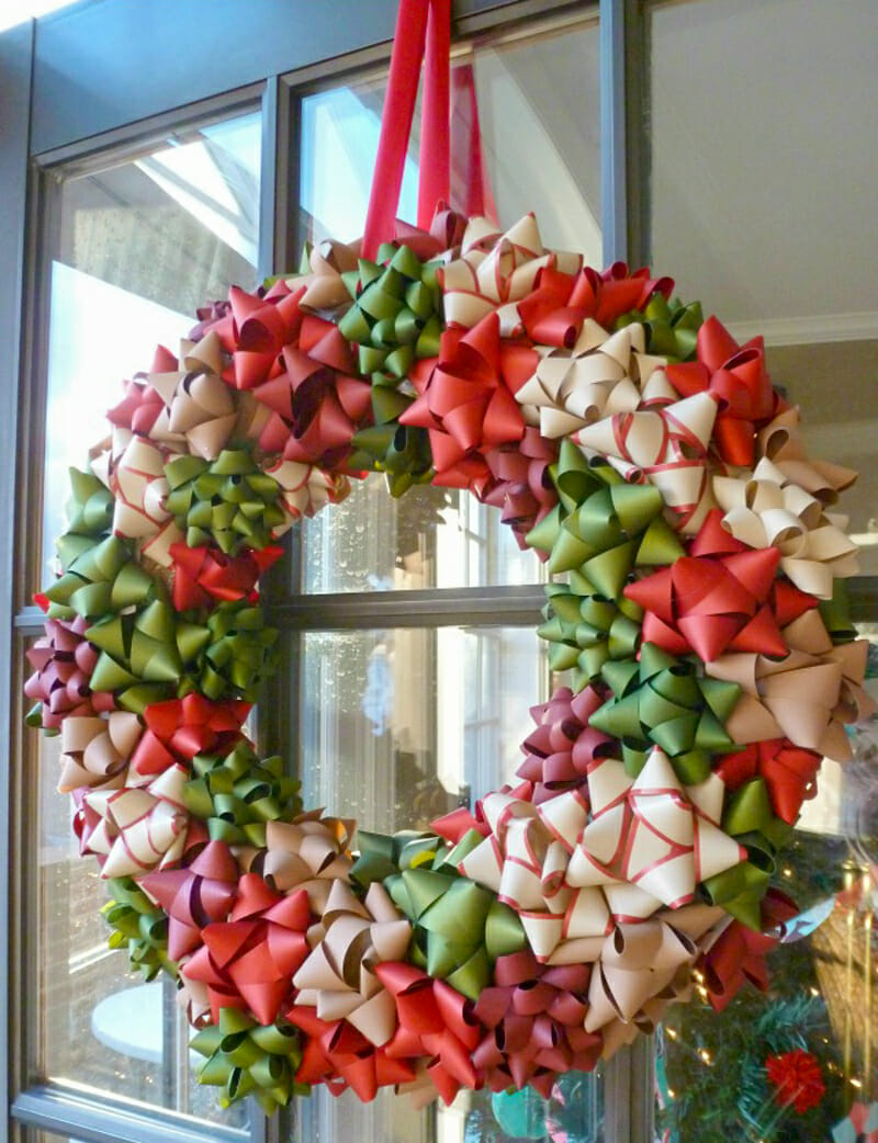 A wreath made from bows hanging on the door.