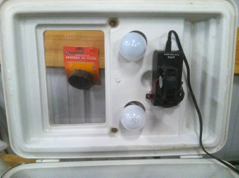 An incubator made from a blue Coleman Cooler.