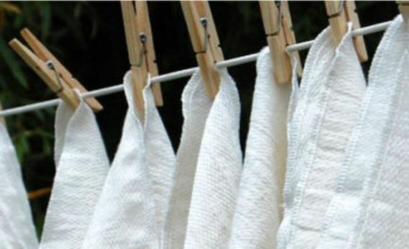 Unpaper towels hanging on a clothesline.