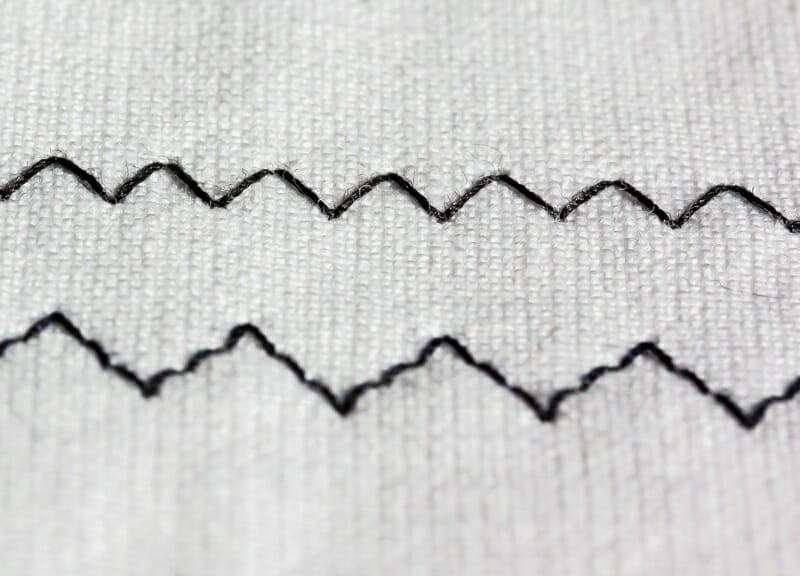 A close up of two different zig-zag stitches.