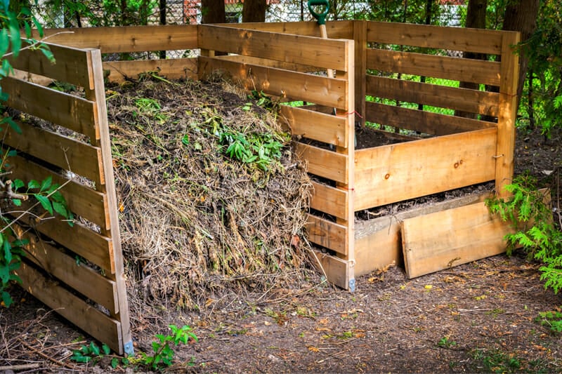 A compost bin filled with leaves, lawn clippings, food scraps, and urine.