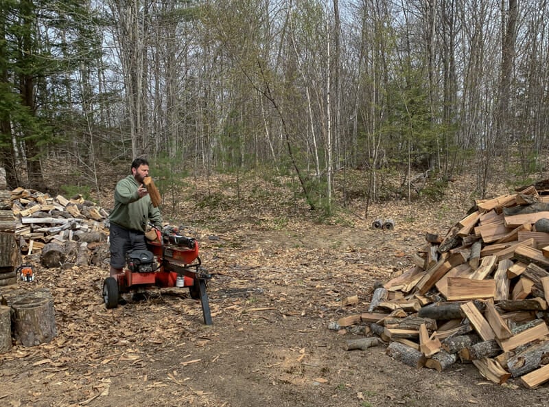 Splitting firewood in the woodyard.