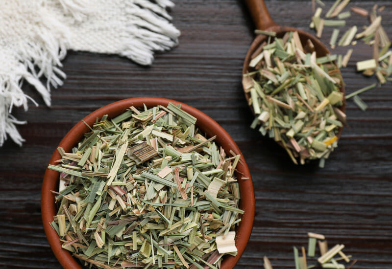 A bowl full of dried lemongrass chopped.