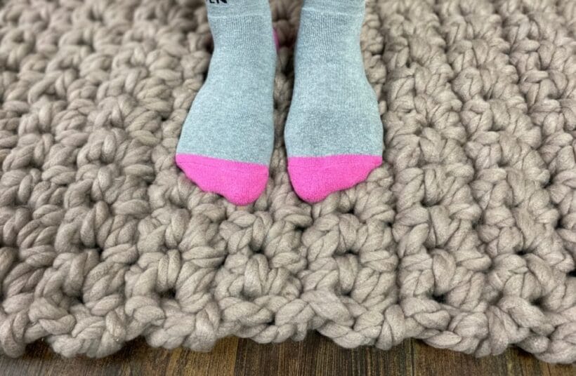 Standing on a chunky, squishy, crocheted rug.