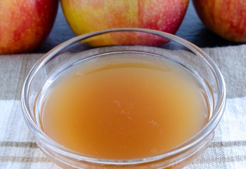 A small bowl of homemade apple cider vinegar.