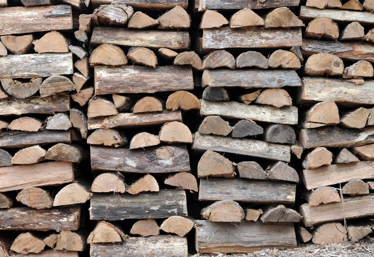 Traditionally stacked firewood with criss-crossed ends for stabilty.