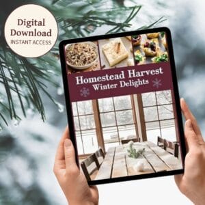 A digital tablet displaying the cover of Homestead Harvest: Winter Delights, featuring images of comforting winter dishes. The background showcases snowy pine branches, evoking a cozy seasonal atmosphere. A circular label highlights "Digital Download – Instant Access."