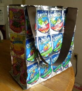 A large grocery bag made from Capri Sun juice pouches.