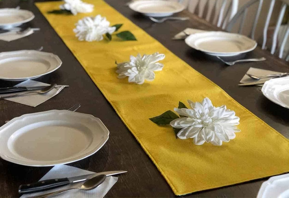 A reversible table runner made from old sheets.