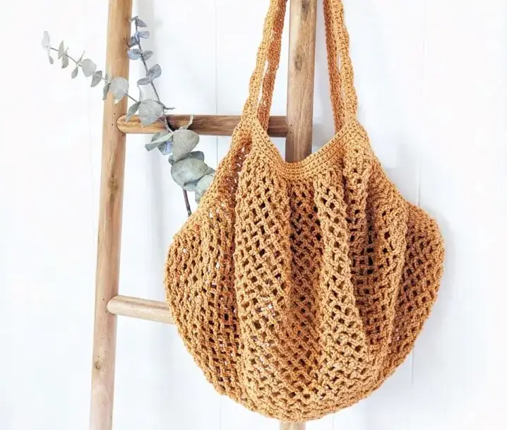 A tan-beige string farmers market bag.