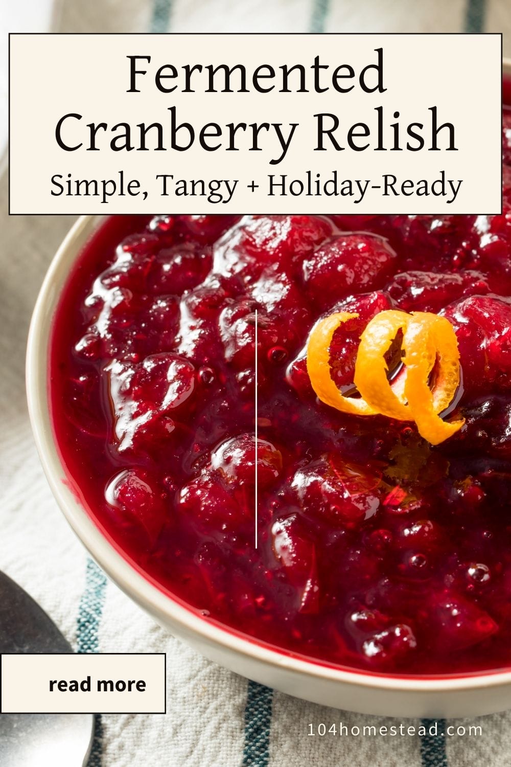 Overhead view of a bowl of bright red cranberry relish topped with orange zest curls, styled on a striped kitchen towel with a “Fermented Cranberry Relish” title overlay for Pinterest.